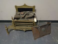 A brass framed log effect electric fire and an antique brass fire canopy
