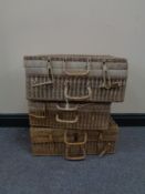 Three graduated wicker cases