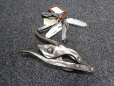 A box of five military pocket knives and wire cutters