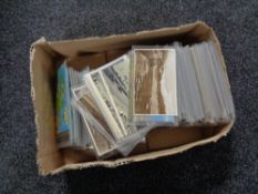 A box of twentieth century black and white & colour postcards