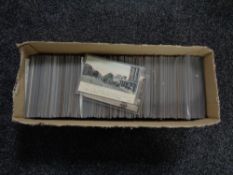 A box of twentieth century black and white & colour postcards