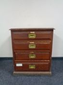 An Edwardian pine four drawer chest with brass drop handles