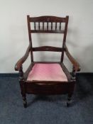 An Edwardian commode armchair