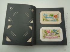 An album of WWI era postcards including silks.