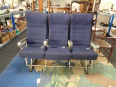 A bank of three aeroplane seats