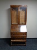 A 1930's oak bureau bookcase
