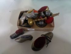 A box of twelve assorted pin cushions