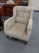 A Victorian horse hair filled armchair in button dralon
