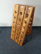 A folding teak Deuba 18 bottle wine rack