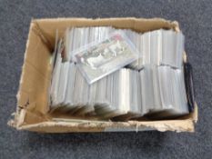 A box of twentieth century black and white & colour postcards