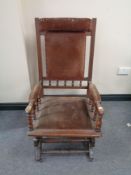 An Edwardian mahogany American style rocking chair