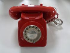 A red cased vintage telephone