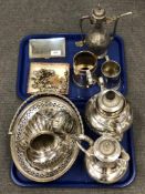 A white metal cigarette box stamped 