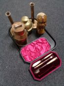 A tray of antique copper candlesticks, lidded flask, brass bell, carved sculpture,