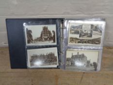 An album of black and white postcards,