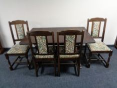 An oak effect refectory table and four chairs