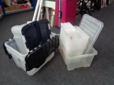 A quantity of plastic storage boxes with lids
