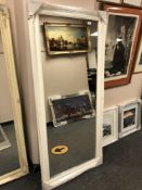 A 5' x 2' white traditional style mirror