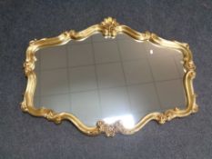 A gilt framed overmantel mirror