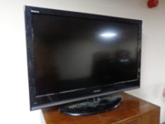 A Toshiba 37 inch LCD TV with remote