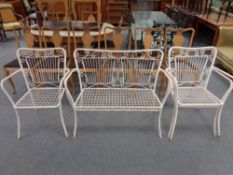 A painted metal two seater garden bench and three matching chairs