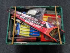 A crate of new tools, screw driver set, hand saw, brass door knocker,