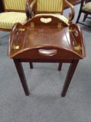 A mahogany butler's tray on stand