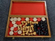 A wooden chess board and pieces