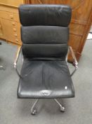 A Vitra Charles Eames designed soft pad executive swivel office chair upholstered in black leather