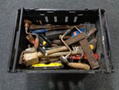 A crate of assorted vintage hand tools