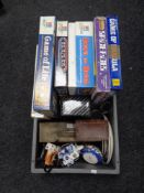 A box of board games, collector's plates,