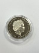 A silver proof £5 coin commemorating D-Day