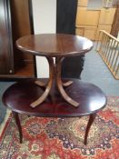 A continental oak pedestal oval dining table