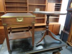 A campaign style leather topped lamp table fitted with a drawer together with a leather topped