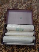 A vintage Sibo luggage case containing wallpaper