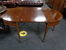 A Victorian mahogany D-end dining table with leaf