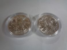 Two one ounce fine silver two pound coins
