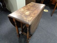 A 20th century oak gate leg table