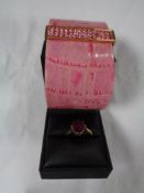 A gold dress ring indistinctly stamped together with a bracelet