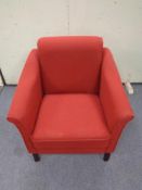 A red upholstered armchair