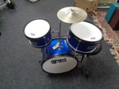 A Mad About child's drum kit with stool