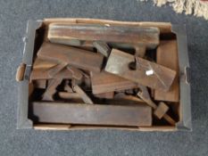 A box of vintage wooden wood planes