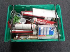 A crate of new tools, chisel set, expanding foam, remote control socket set,