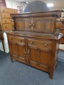 An Ercol elm buffet back sideboard