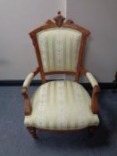 A continental walnut salon armchair in green classical fabric