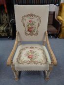 A Continental beech framed armchair on barleytwist supports