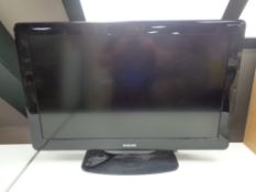 A Philips 32 inch LCD TV with remote (continental wiring)