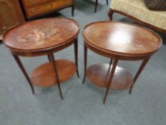 A pair of inlaid mahogany oval occasional tables