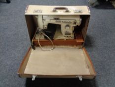 A cased 20th century National sewing machine (continental wiring)