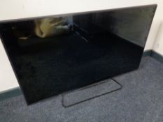 A Philips 46 inch TV with remote (continental wiring)